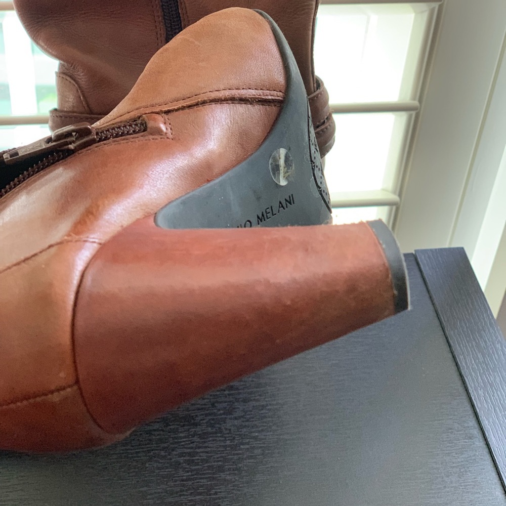 Soft leather boots , sits below knee